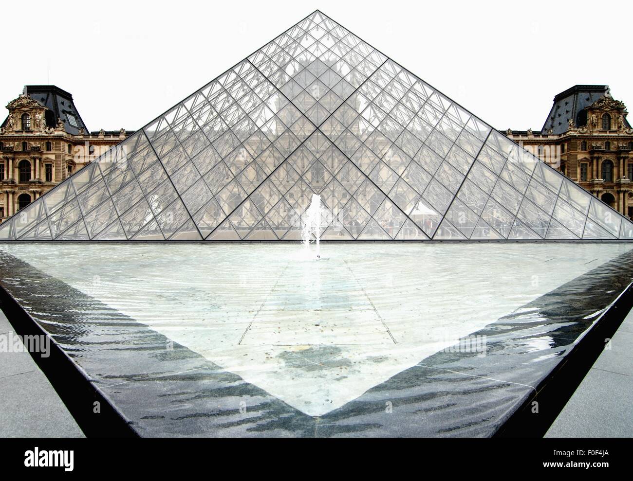 The glass pyramid roof and fountain over the lower levels of the Louvre, Paris. Stock Photo