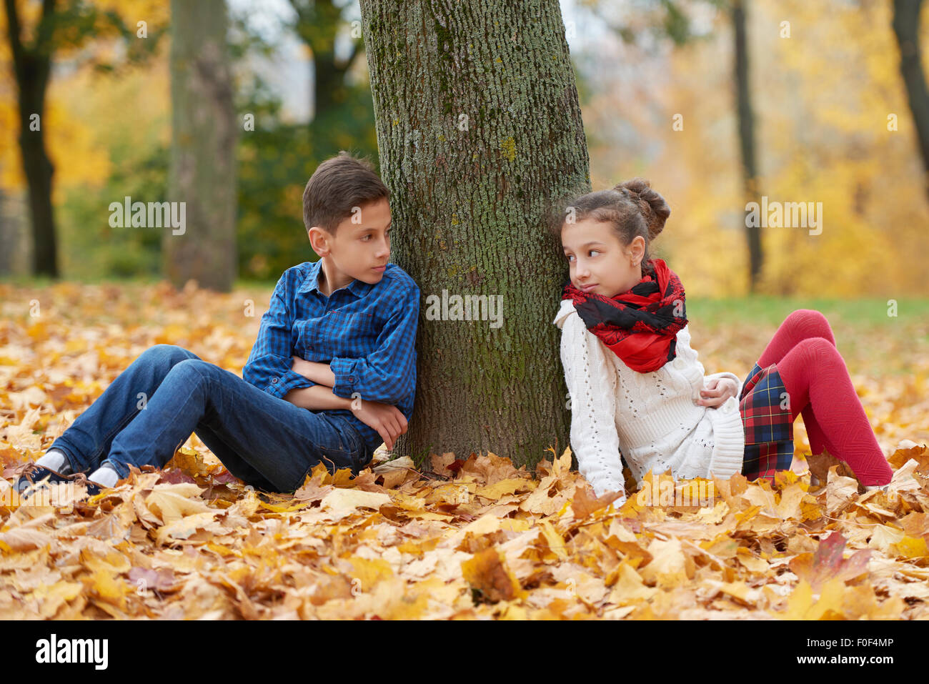 boy and girl in autumn park Stock Photo