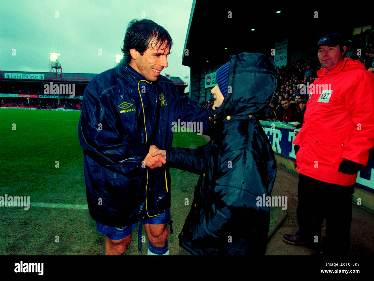 Chelsea legend Gianfranco Zola meets a young fan at The Dell Southampton FC home ground before the match Stock Photo