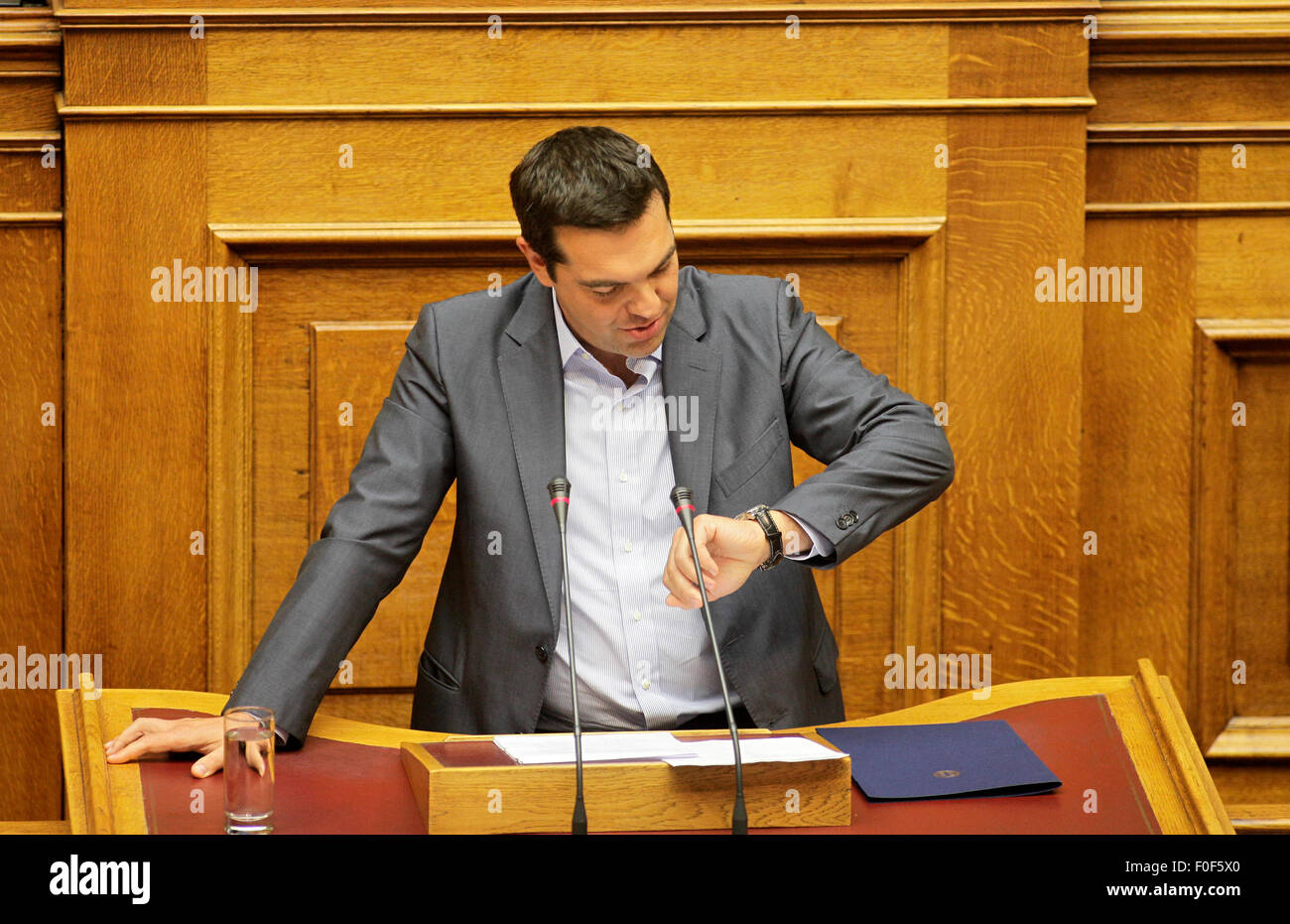 Athens. 14th Aug, 2015. Greek Prime Minister Alexis Tsipras gives a speech before the roll call vote in the parliament in Athens, Greece, Aug. 14, 2015. The Greek Parliament on Friday ratified the country's third bailout deal since 2010 to secure vital international financing to remain afloat and stay in the euro zone. © Xinhua/Alamy Live News Stock Photo