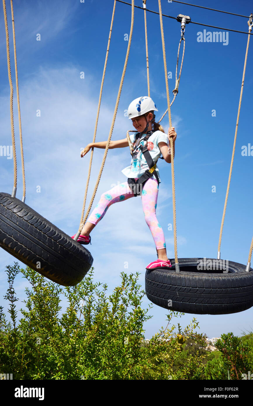 Young Girl On An Aerial Adventure High Rope Course Algarve Portugal Stock Photo