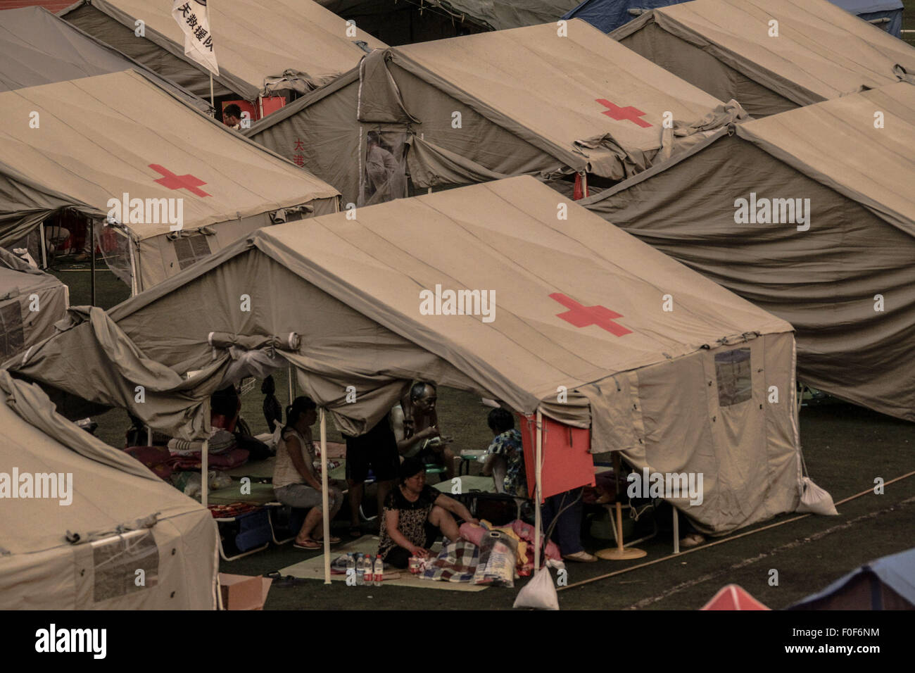 (150814) -- TIANJIN, Aug. 14, 2015 (Xinhua) -- Photo taken on Aug. 14, 2015 shows a temporary shelter set up after the warehouse explosion in Tianjin, north China. Drinking water, food, clothes and quilts are adequate at the shelter. (Xinhua/Zheng Huansong)(mcg) Stock Photo