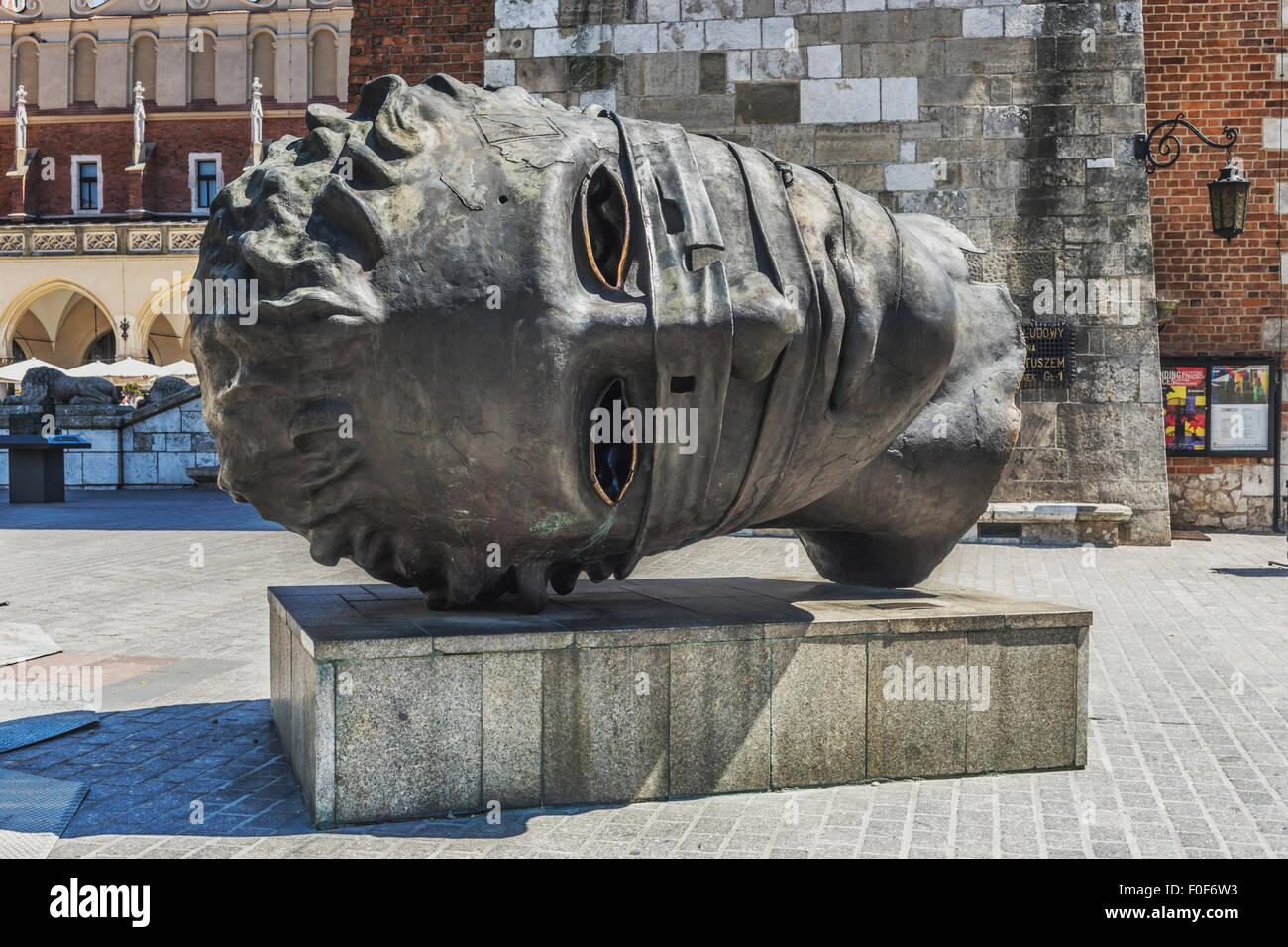 The bronze sculpture Eros Bendato is located on the Krakow Main Market Square, a work of Igor Mitoraj,  Poland, Europe Stock Photo