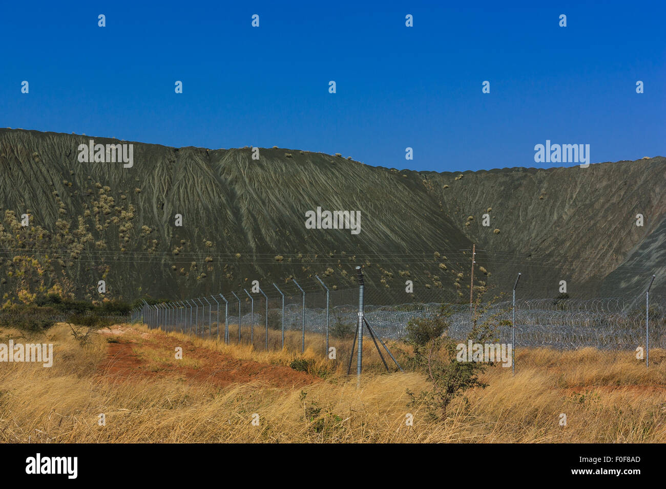 Diamond mine in mountain area Botswana, Africa. Area is fenced with barb wire. Stock Photo