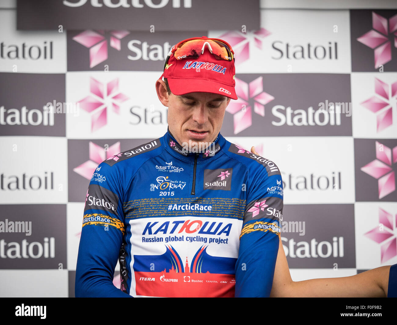 Setermoen, Norway. 14th August 2015. Alexander Kristoff from Norway cycling for Team Katusha is putting on the blue leaders jersey after the 2nd stage of Arctic Race of Norway 2015. The stage was 162,5km and started in Evenskjaer and ended in Setermoen. Alexander Kristoff ended as number 3 in the 2nd stage. Credit:  Ole Mathisen/Alamy Live News Stock Photo