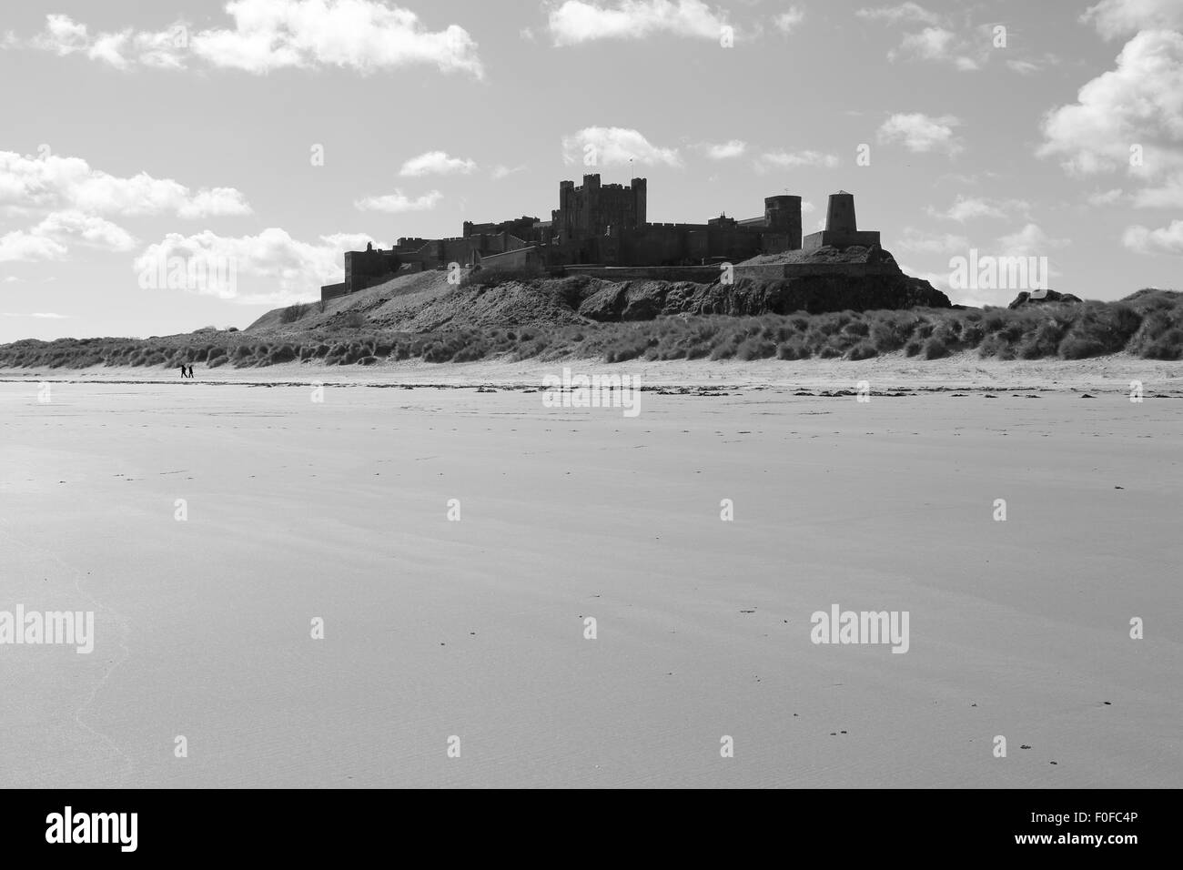 Bamburgh Castle, Northumberland, England, UK, shown in black and white. Stock Photo