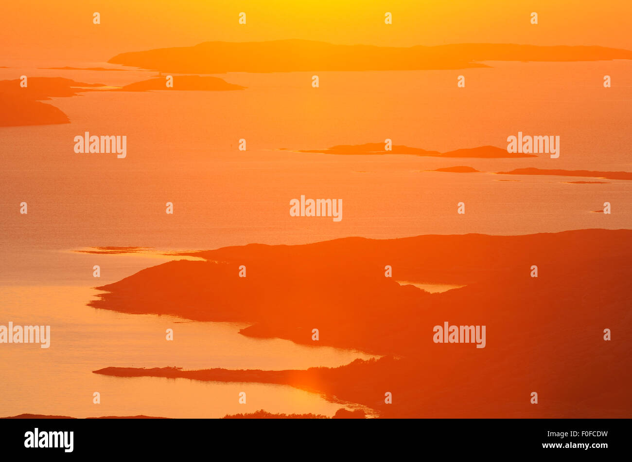 Aerial view of coast with sun low on the horizon, Flatanger, Nord ...