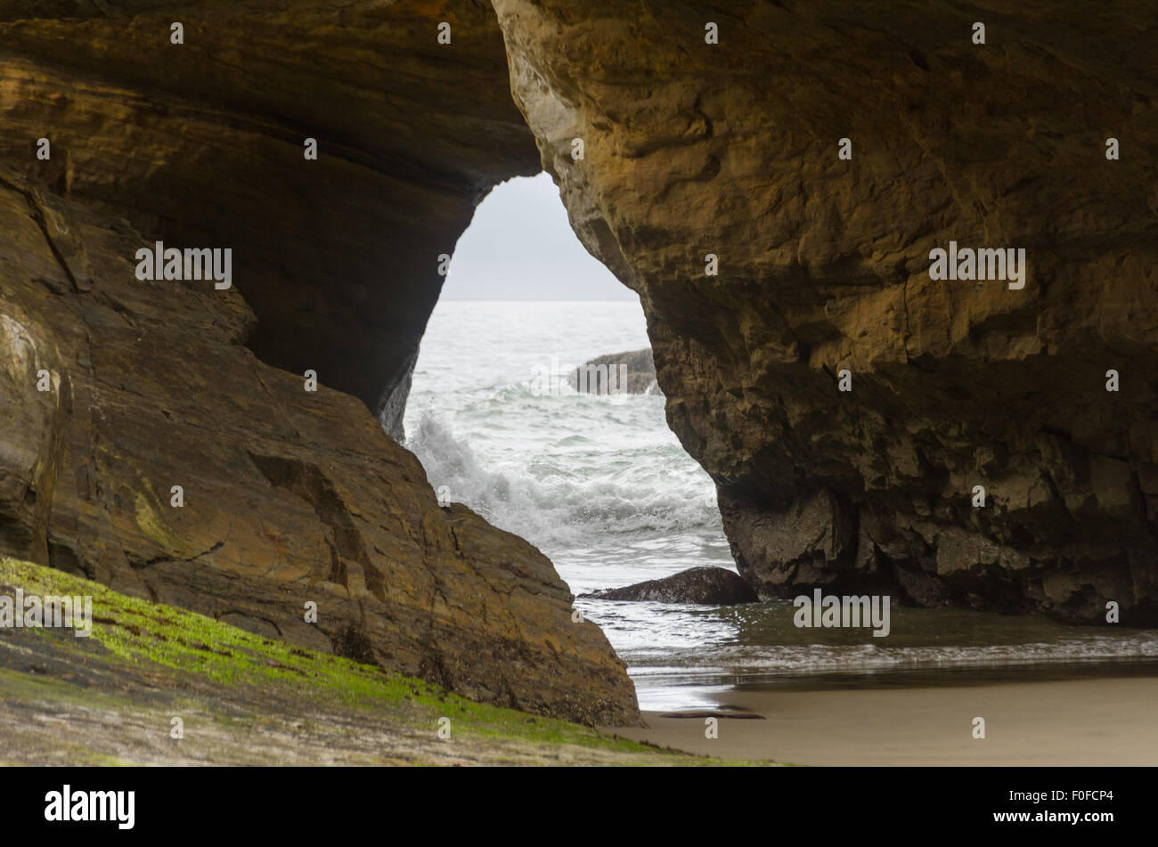 A sea cave at Devil's Punchbowl park, Oregon Coast, USA. Stock Photo