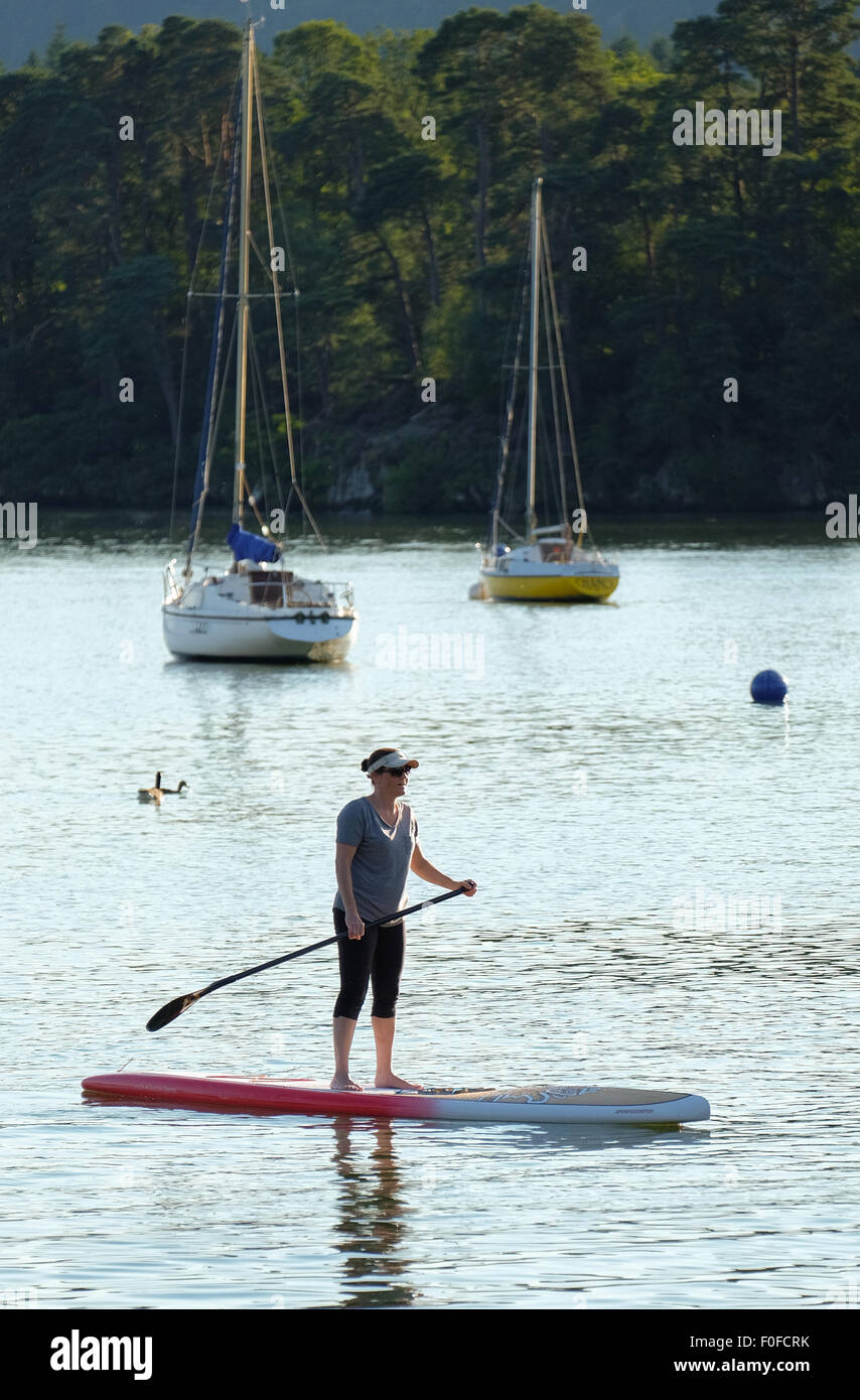 Paddle boarding on Lake Windermere in the Lake District, Cumbria, UK Stock Photo