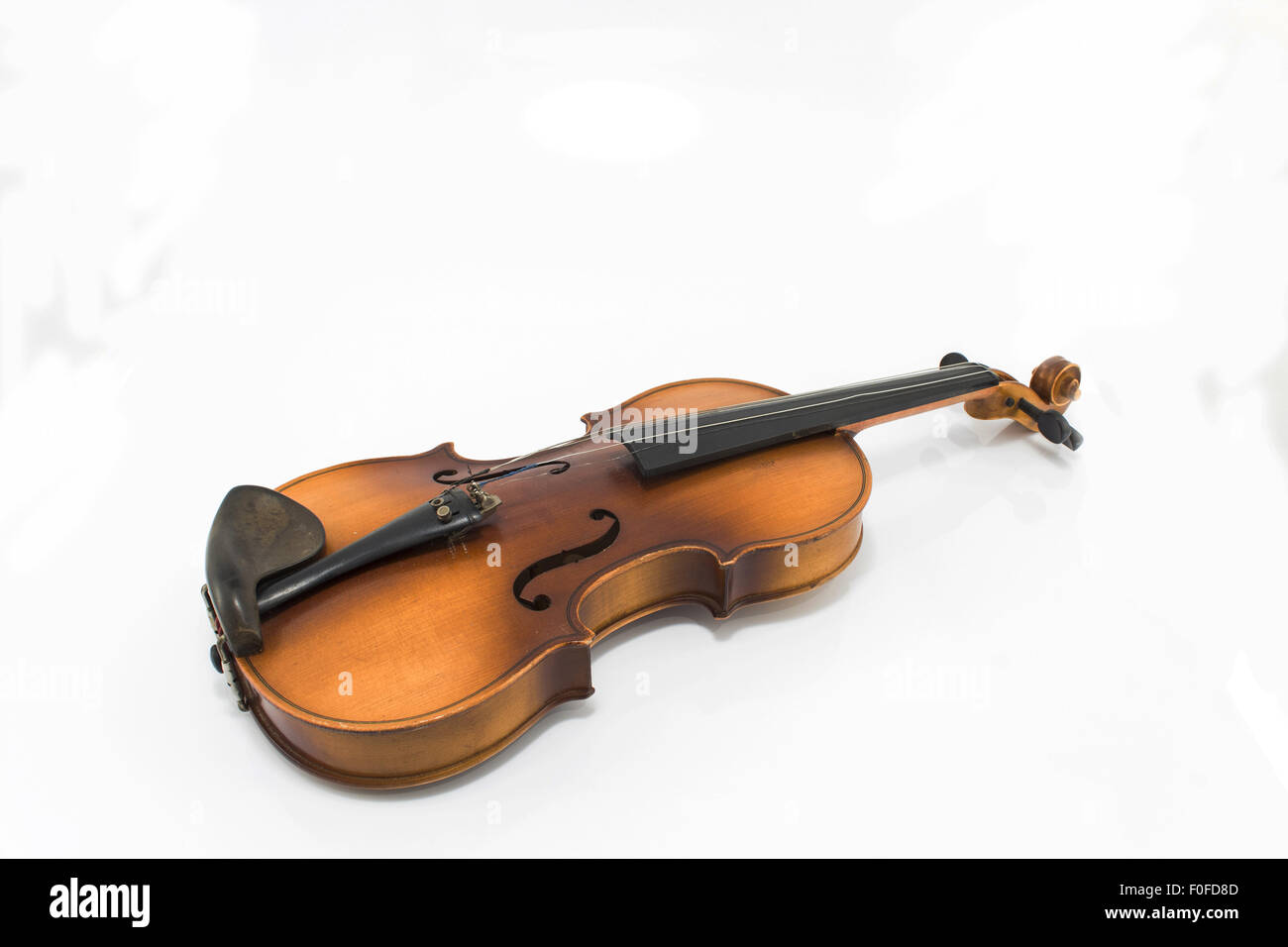 Old violin isolated on white. Stock Photo