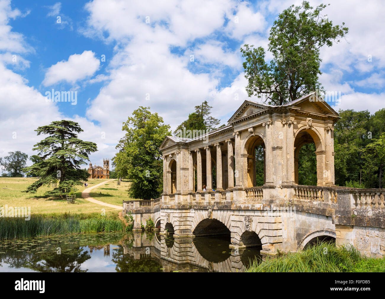 The Palladian Bridge with the Gothic Temple in the distance, Stowe Landscape Gardens, Stowe House, Buckinghamshire, England, UK Stock Photo