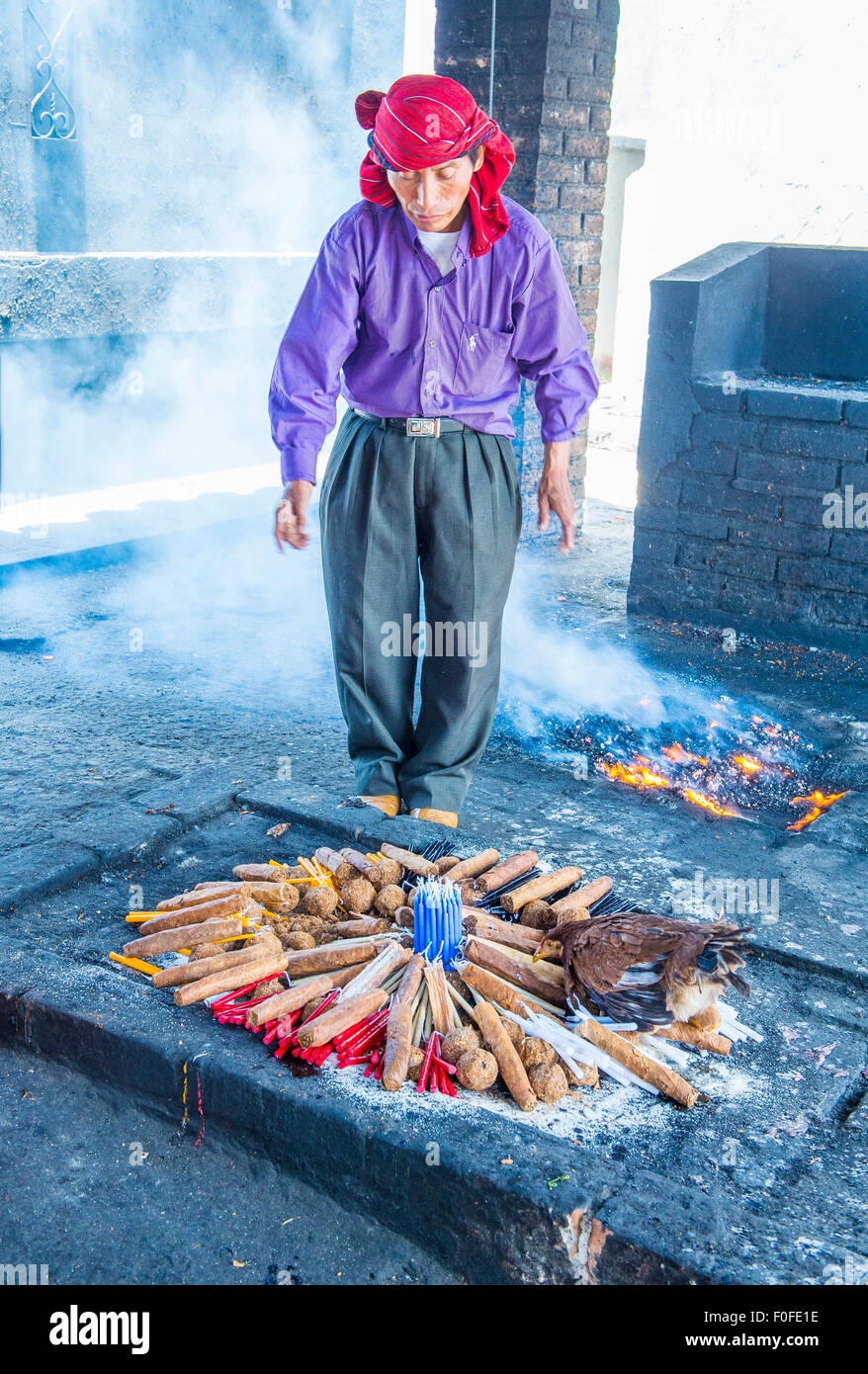 Guatemalan man take part in a traditional Mayan ceremony in Chichicastenango , Guatemala Stock Photo