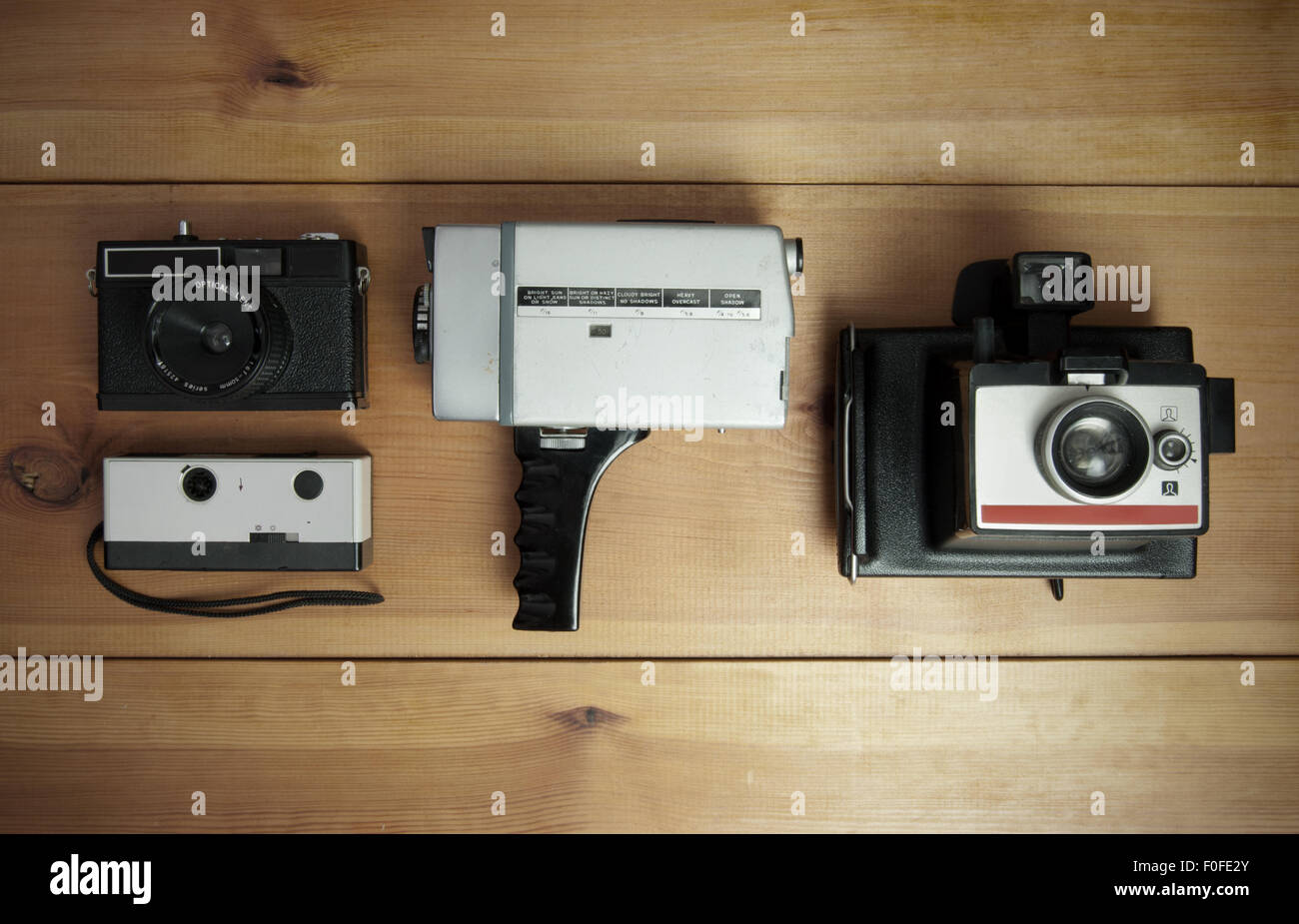 Vintage collection of cameras including polaroid, film and 8mm video Stock Photo