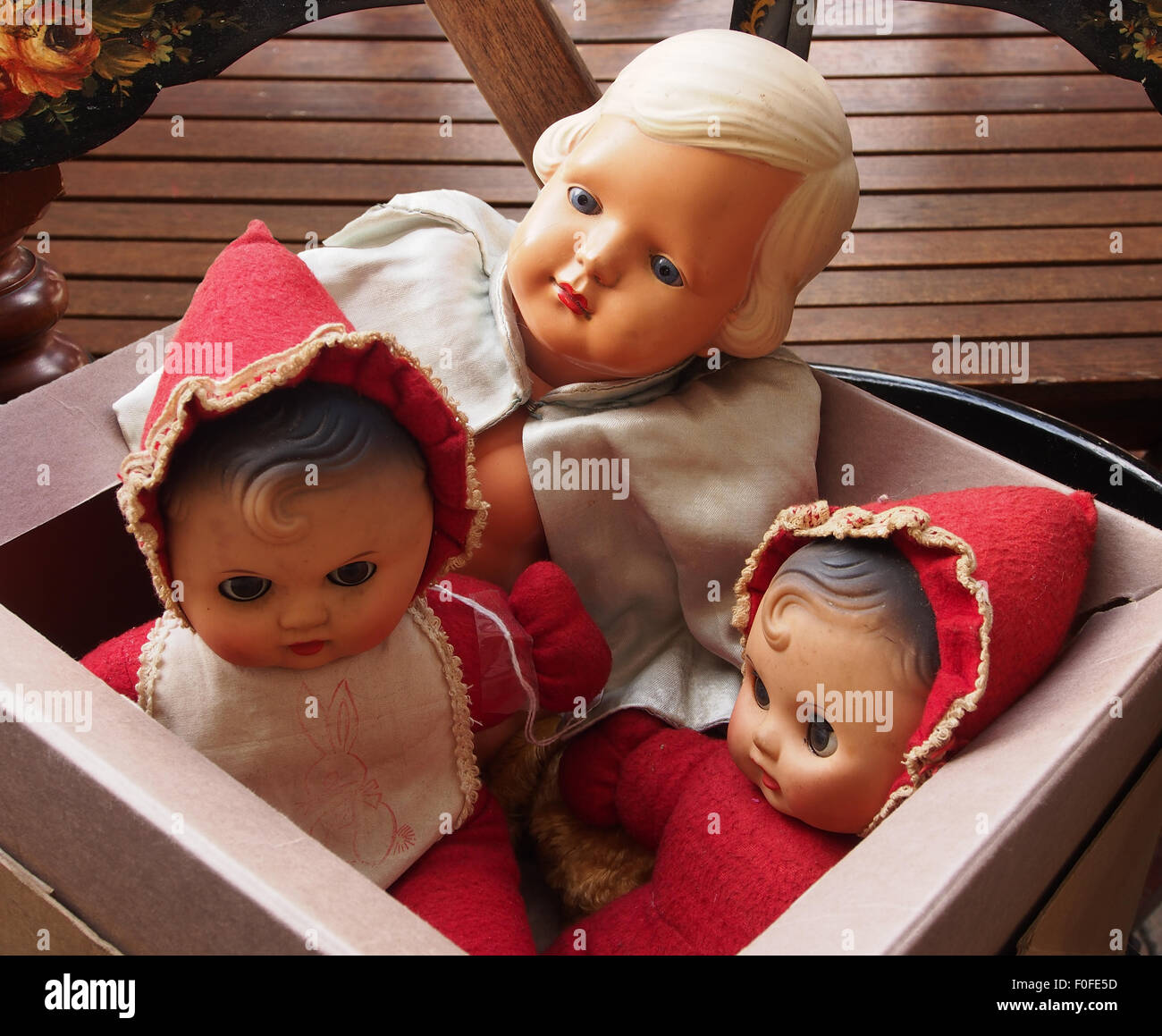 Box of antique porcelain headed dolls. Stock Photo