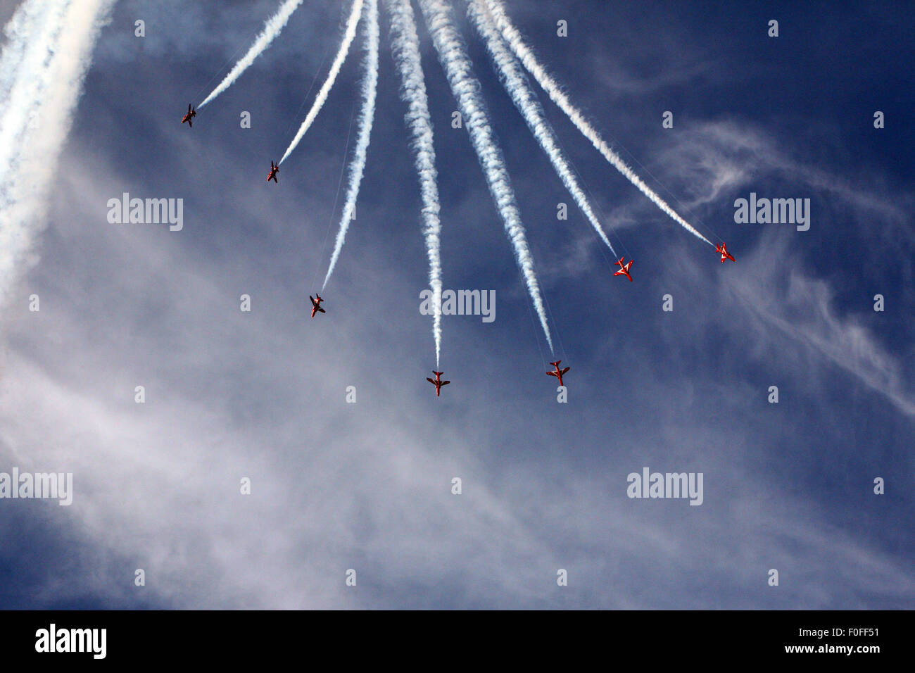 Red Arrows leaving  vapour trails above Falmouth Stock Photo
