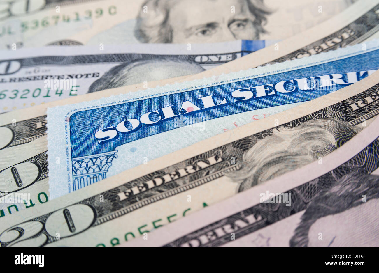 Social security card and American money dollar bills close up concept Stock Photo