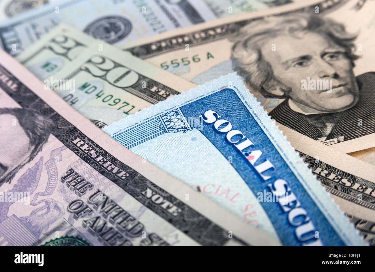Social security card and American money dollar bills close up concept Stock Photo