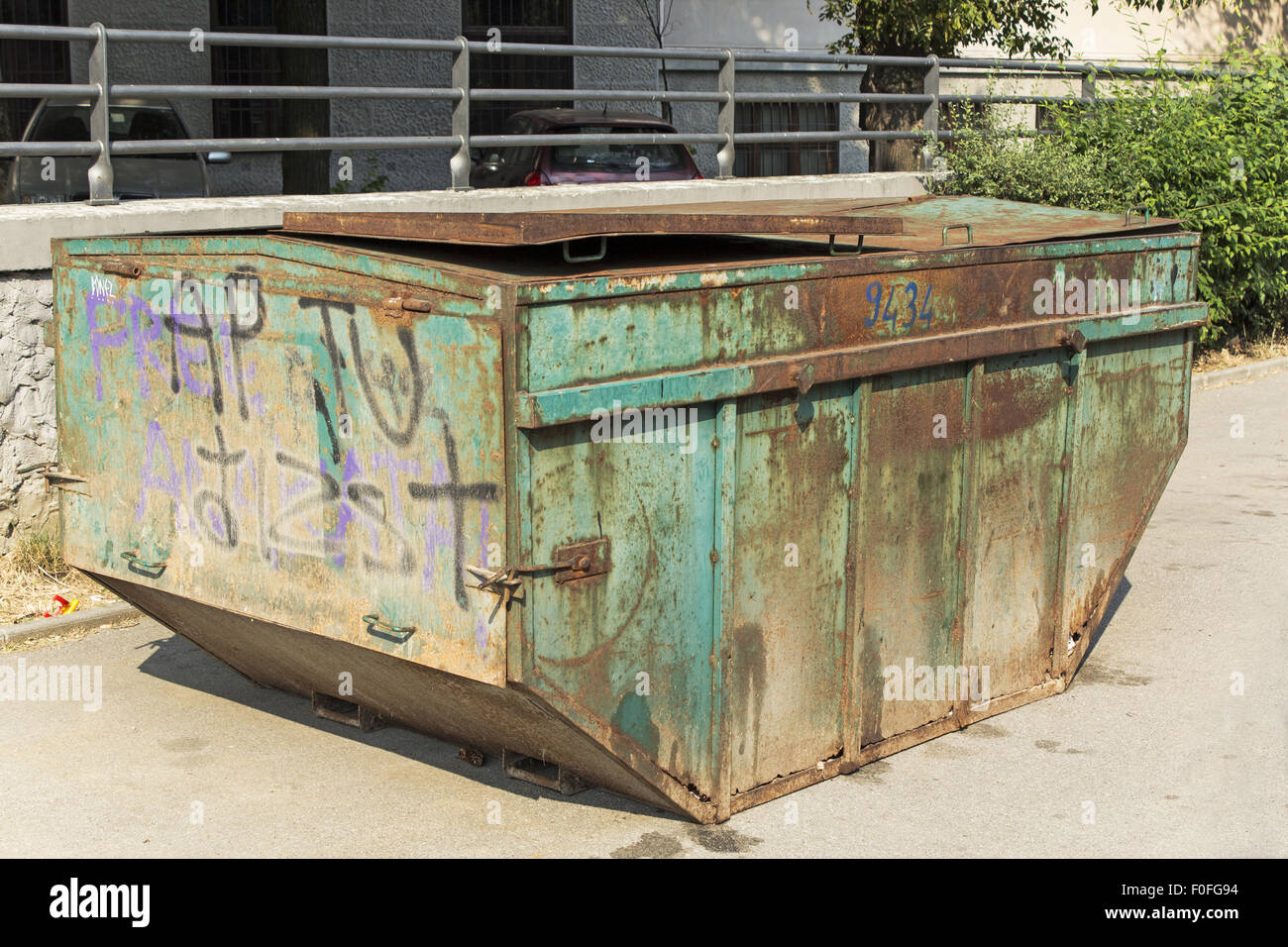 Old green rusted dumpster for trash Stock Photo Alamy
