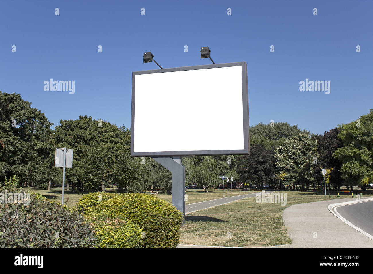 Blank billboard in the park Stock Photo - Alamy