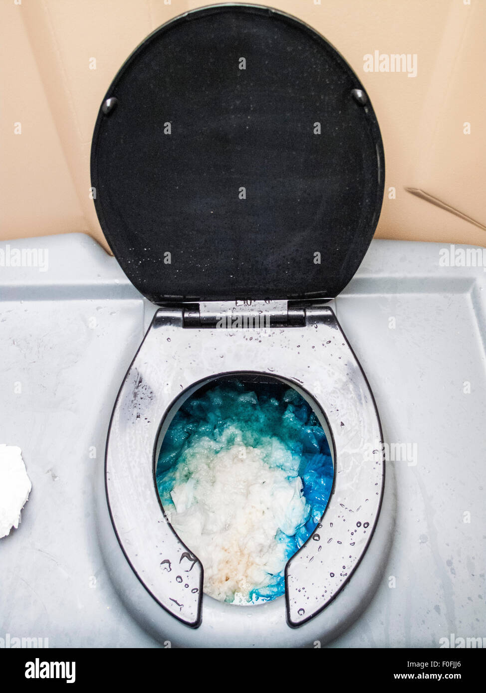 Portable toilet full of waste Stock Photo