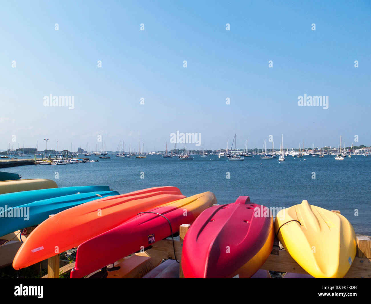 Colorful upside down kayaks. Newport, Rhode Island, USA Stock Photo