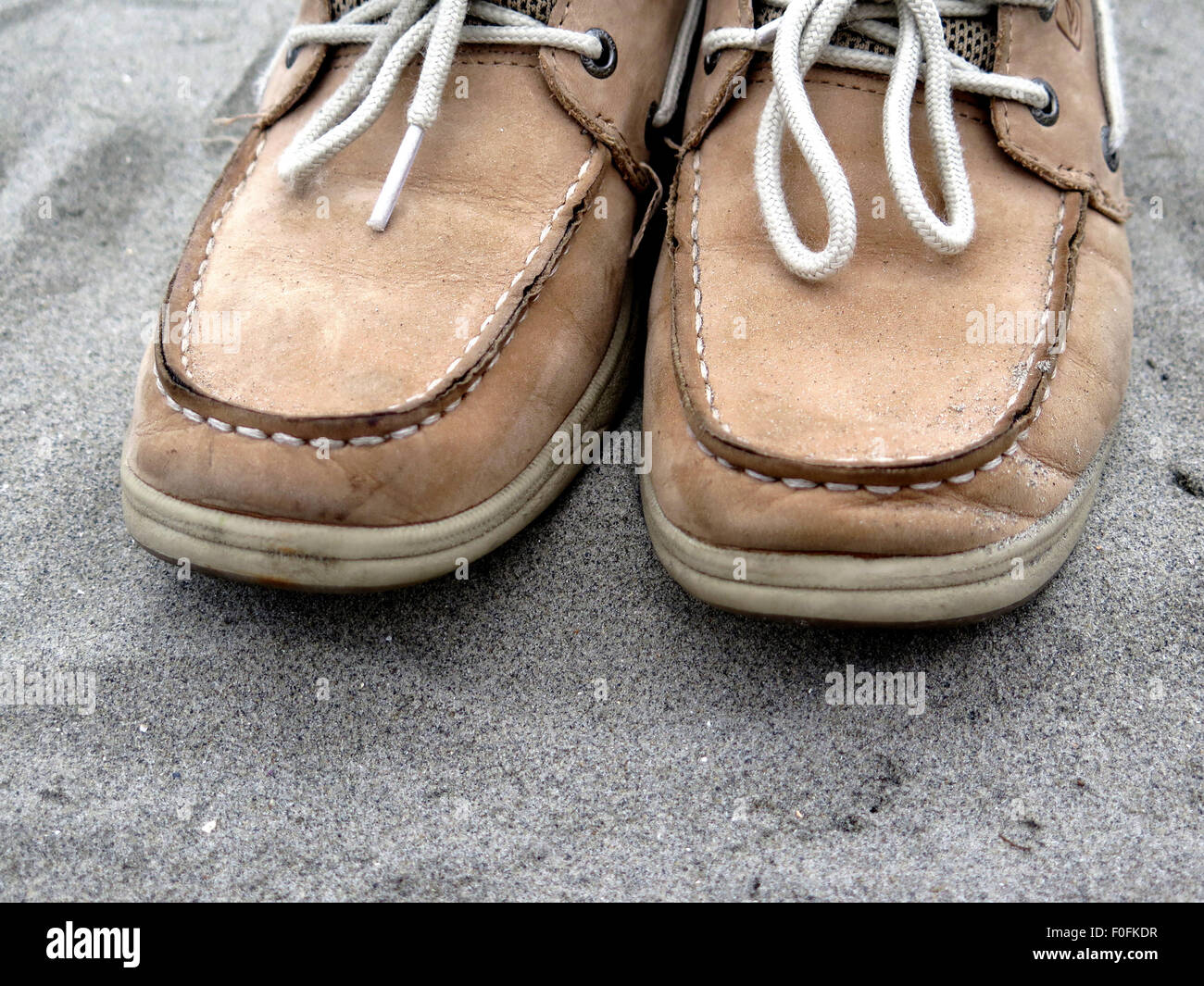 Deck shoes in sand Stock Photo