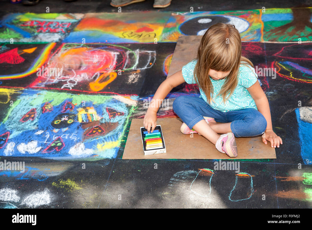Kid painting at Italian Street Painting, San Rafael, California, USA Stock Photo