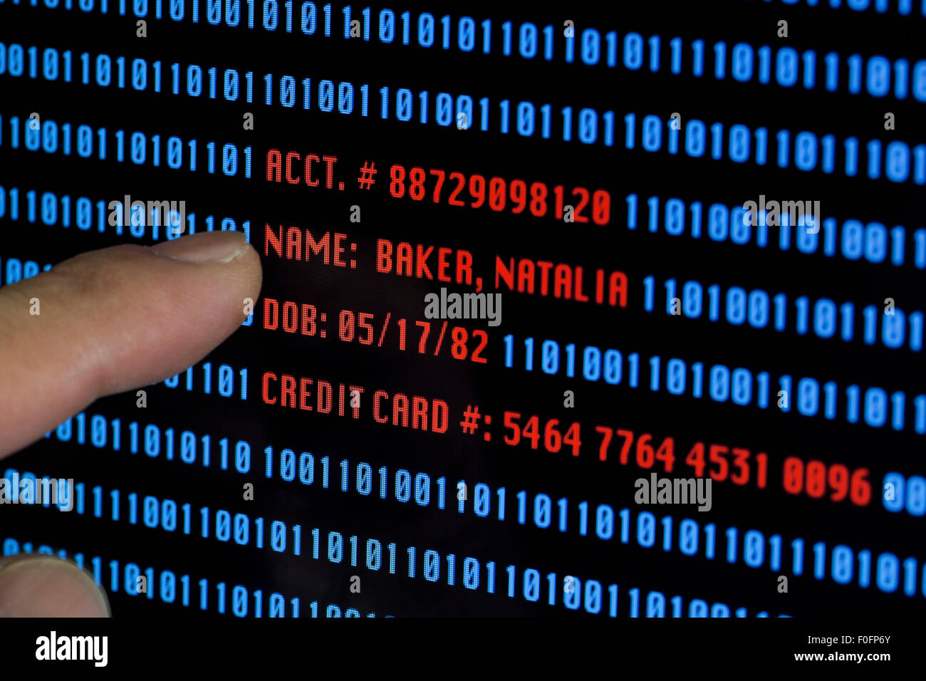 Man pointing to personal and sensitive information on computer screen (information is fictional) Stock Photo