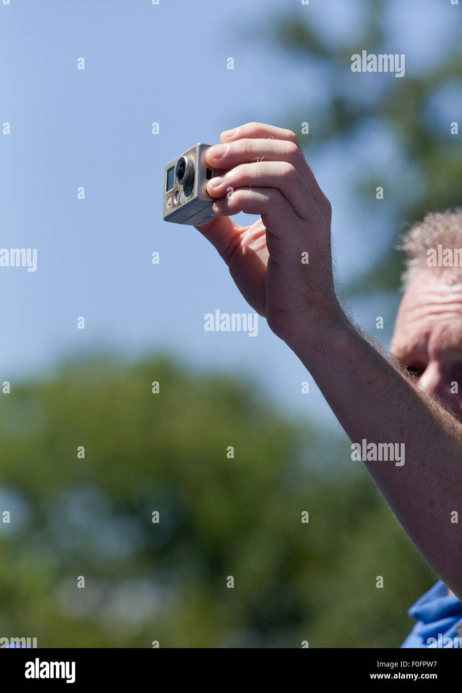 Man using GoPro Hero action camera - USA Stock Photo