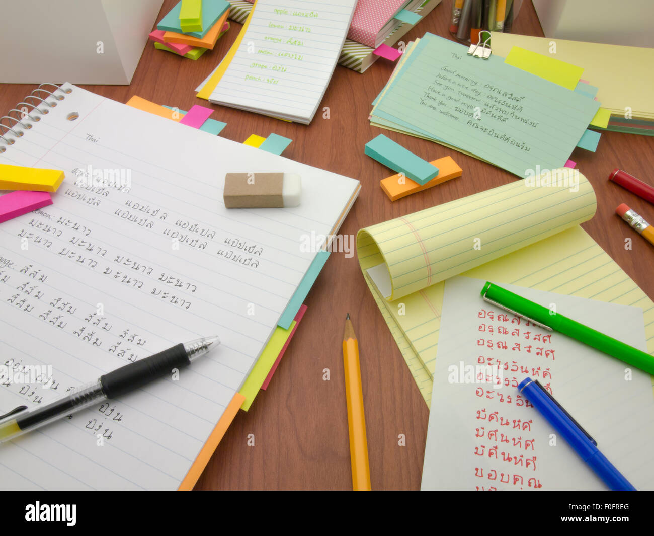Writing new words again and again to learn new language. Stock Photo