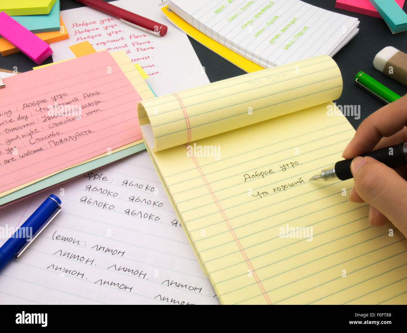 Writing new words again and again to learn new language Stock Photo - Alamy