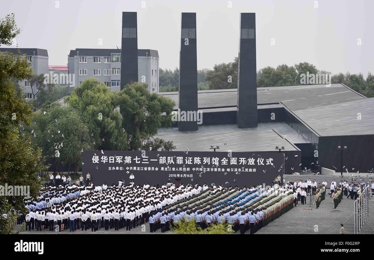 People attend the opening ceremony of a museum about Japanese Army Unit 731 wartime atrocities in Harbin, capital of northeast China's Heilongjiang Province, Aug. 15, 2015. The Museum of Evidence of War Crimes by Japanese Army Unit 731, located on the site of former headquarters of Japanese army unit 731 in Harbin, opened on Saturday. Unit 731 was a biological and chemical warfare research base established in 1935. At least 3,000 people died at the base between 1939 and 1945, mostly in experiments for the development of biological weapons. Stock Photo