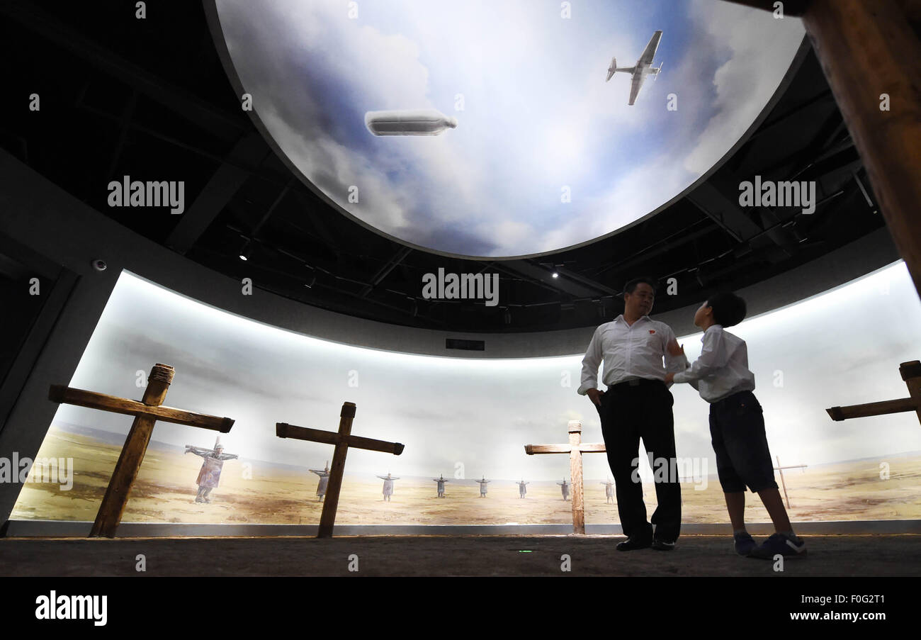 South Korean visitors are seen at the newly-opened museum about Japanese Army Unit 731 wartime atrocities in Harbin, capital of northeast China's Heilongjiang Province, Aug. 15, 2015. The Museum of Evidence of War Crimes by Japanese Army Unit 731, located on the site of former headquarters of Japanese army unit 731 in Harbin, opened on Saturday. Unit 731 was a biological and chemical warfare research base established in 1935. Stock Photo