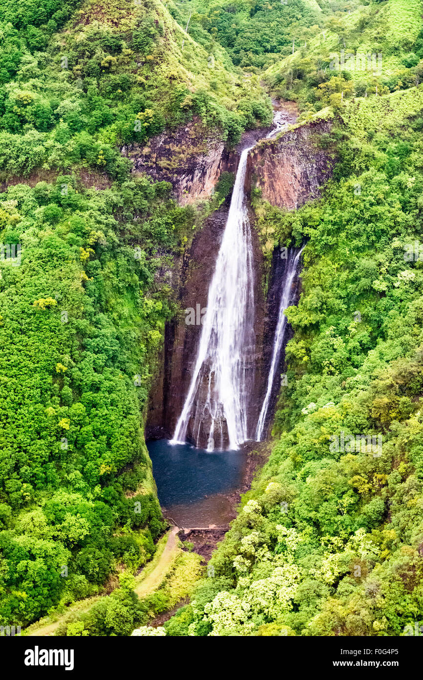 A view of Jurassic falls in the interior of Kauai Island, Hawaii shot from a door-free helicopter Stock Photo