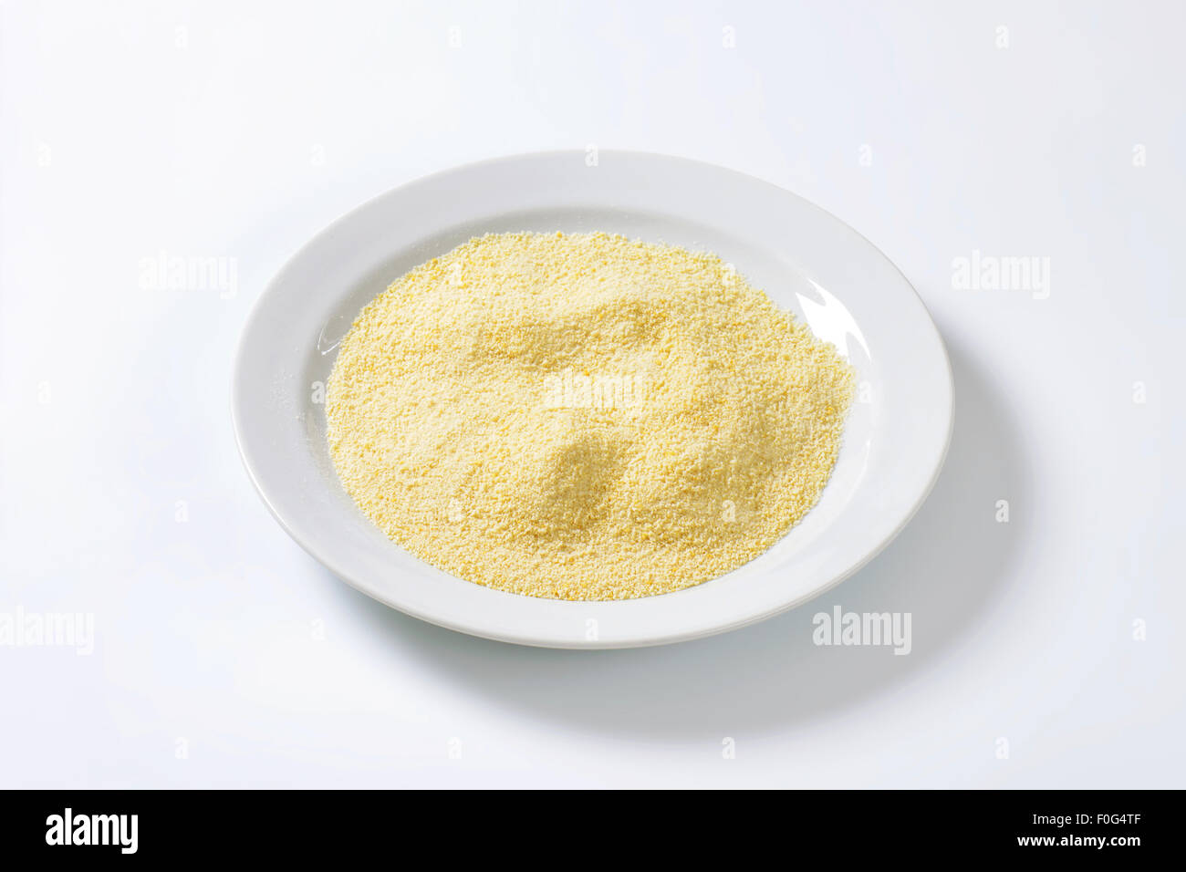 Pile of finely ground bread crumbs on plate Stock Photo
