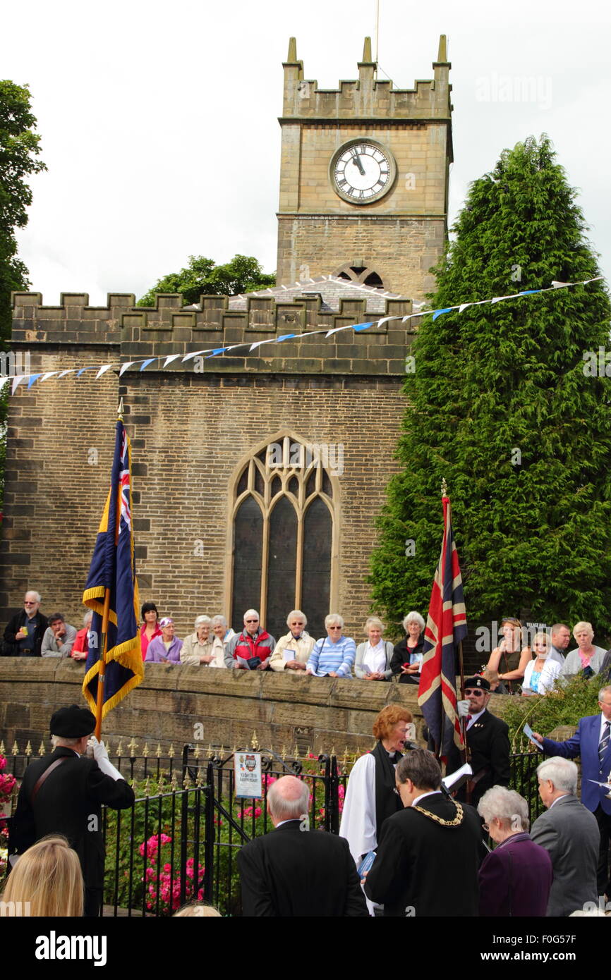 Hayfield, High Peak, Derbyshire, UK. 15 Aug, 2015. The Hayfield branch of the Royal British Legion marks Victory over Japan Day with a special service of thanksgiving at Hayfield War Memorial in the centre of this pretty High Peak village on the fringe of the Peak District National Park. Led by Branch Chaplain, Reverend Hilary Edgerton, the service marked the 70th Anniversary of victory over Japanese forces. Credit:  Deborah Vernon/Alamy Live News Stock Photo