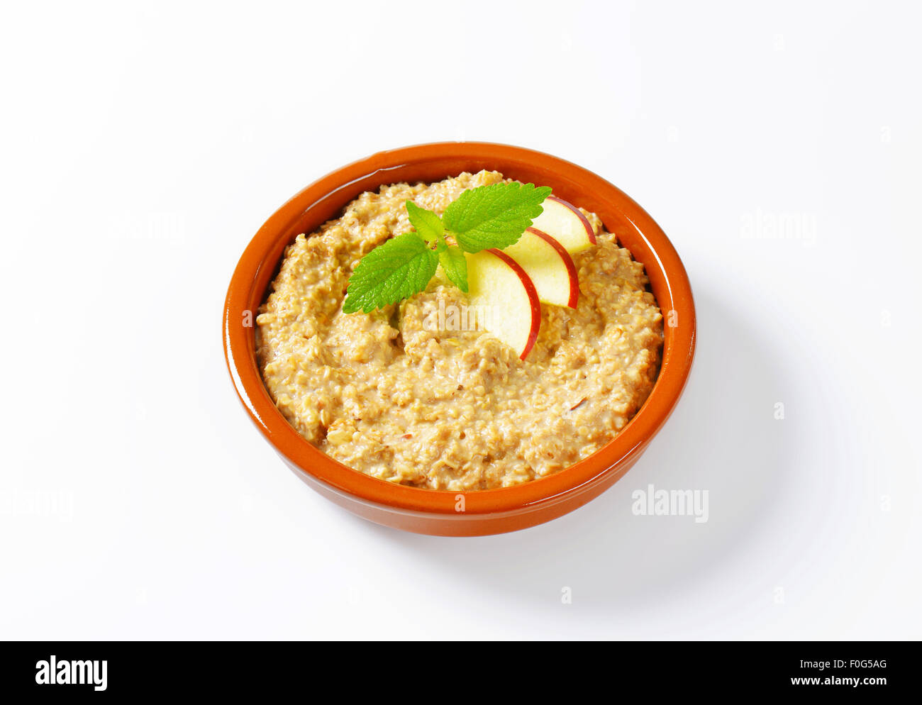 Bowl of white oats porridge Stock Photo