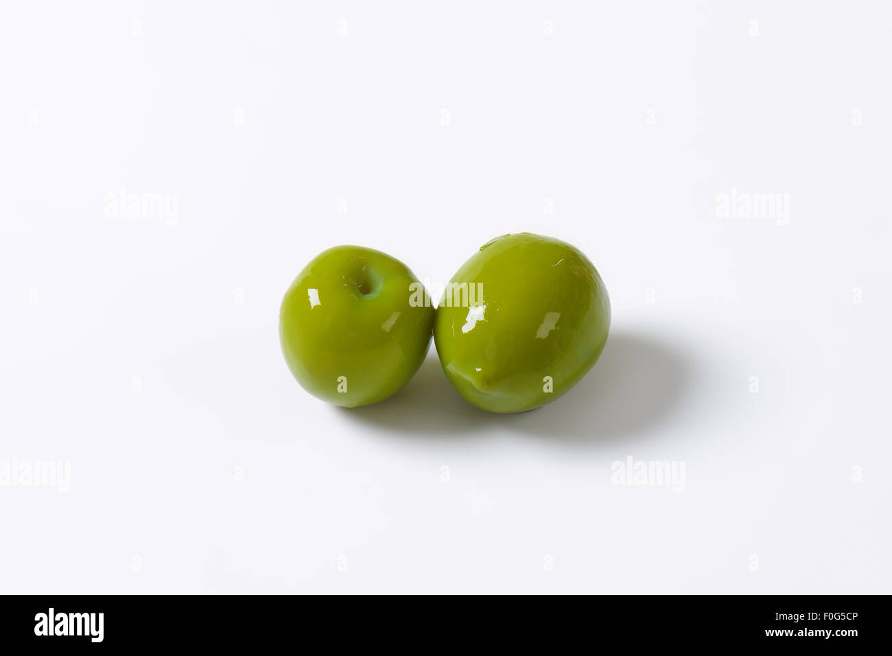 Fresh green olives on white background Stock Photo - Alamy
