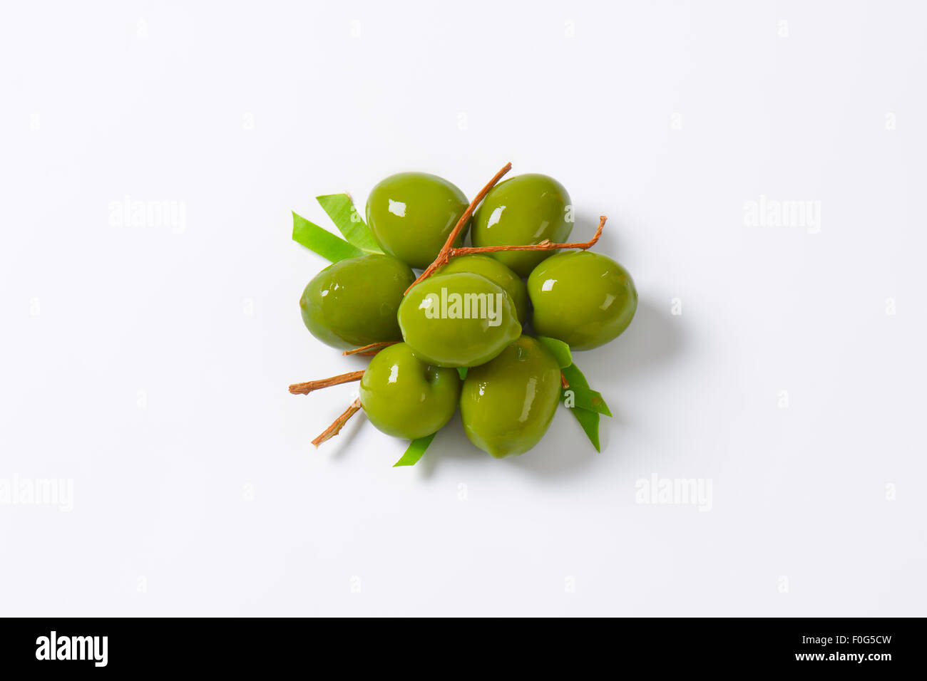 Fresh green olives on white background Stock Photo - Alamy