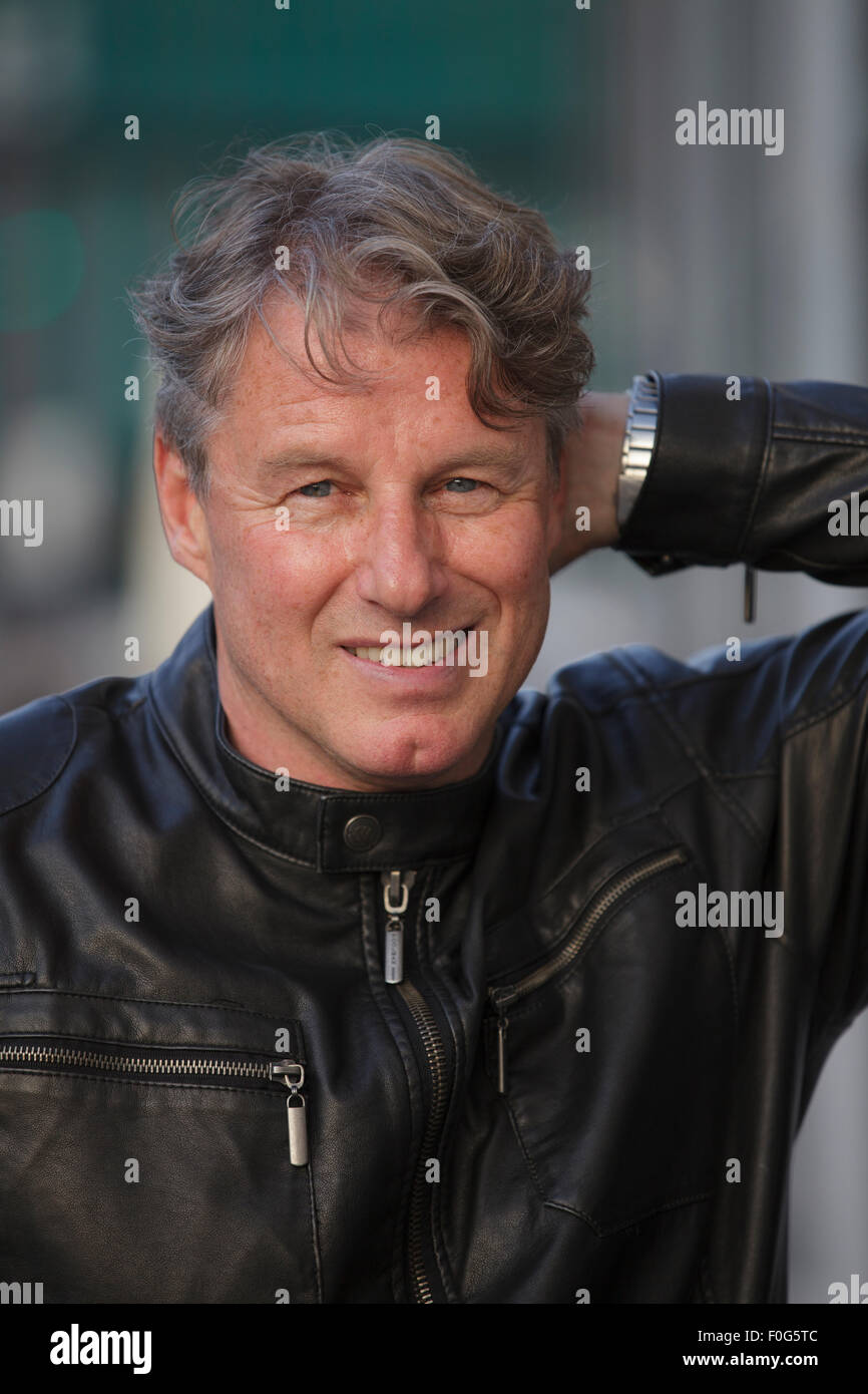 Portrait of mature man wearing black leather jacket, closeup Stock Photo