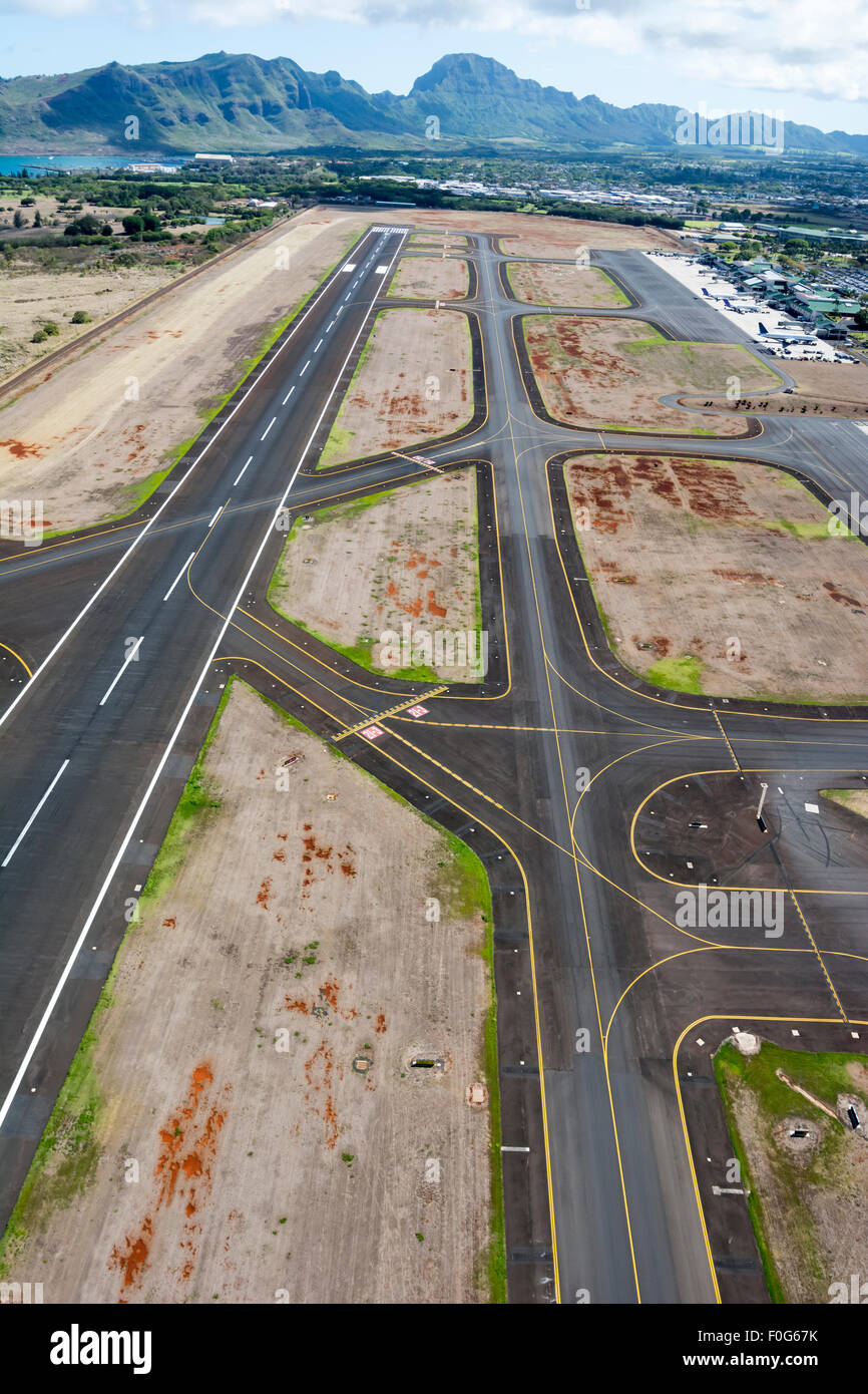 An airport runway from the open door of a helicopter shows the complicated layout pilots must navigate when landing. Stock Photo