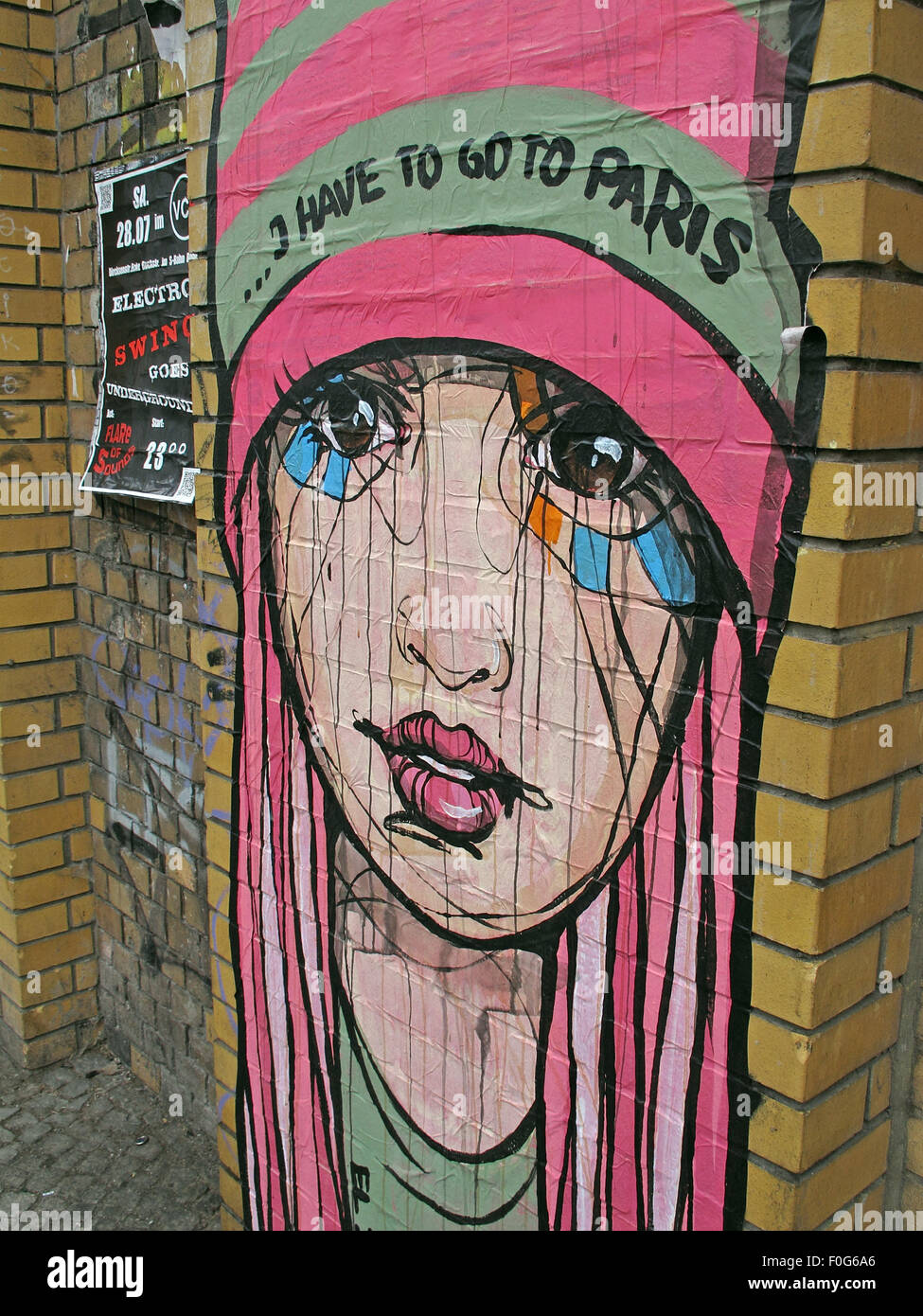 Girl Grafitti on a Berlin wall,street,art,Germany - I have to go to Paris in pink Stock Photo