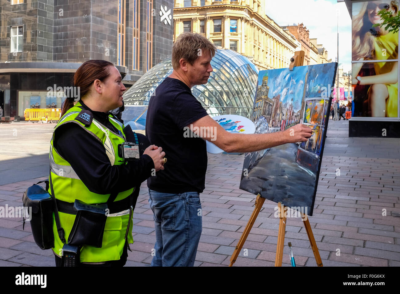 Glasgow, Scotland, UK. 15th Aug, 2015. Almost 150 artists came to Glasgow to take part in the 'Rapid Painter' art competition with the aim being to make a painting capturing the spirit of Glasgow city, completed in 1 day. The artists attracted a lot of curiosity and interest from tourists and locals, when they set up in various locations about the city. All the completed works will go on exhibition on Sunday 16 August at the Royal Concert Hall, Sauchiehall Street, Glasgow when many of the paintings will be for sale. Credit:  Findlay/Alamy Live News Stock Photo