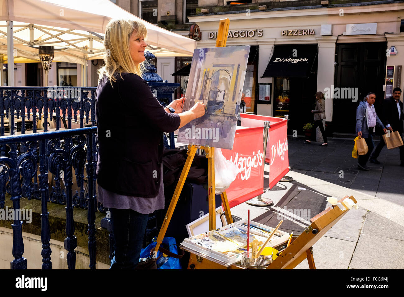 Glasgow, Scotland, UK. 15th Aug, 2015. Almost 150 artists came to Glasgow to take part in the "Rapid Painter" art competition with the aim being to make a painting capturing the spirit of Glasgow city, completed in 1 day. The artists attracted a lot of curiosity and interest from tourists and locals, when they set up in various locations about the city. All the completed works will go on exhibition on Sunday 16 August at the Royal Concert Hall, Sauchiehall Street, Glasgow when many of the paintings will be for sale. Credit: Findlay/Alamy Live News Stock Photo