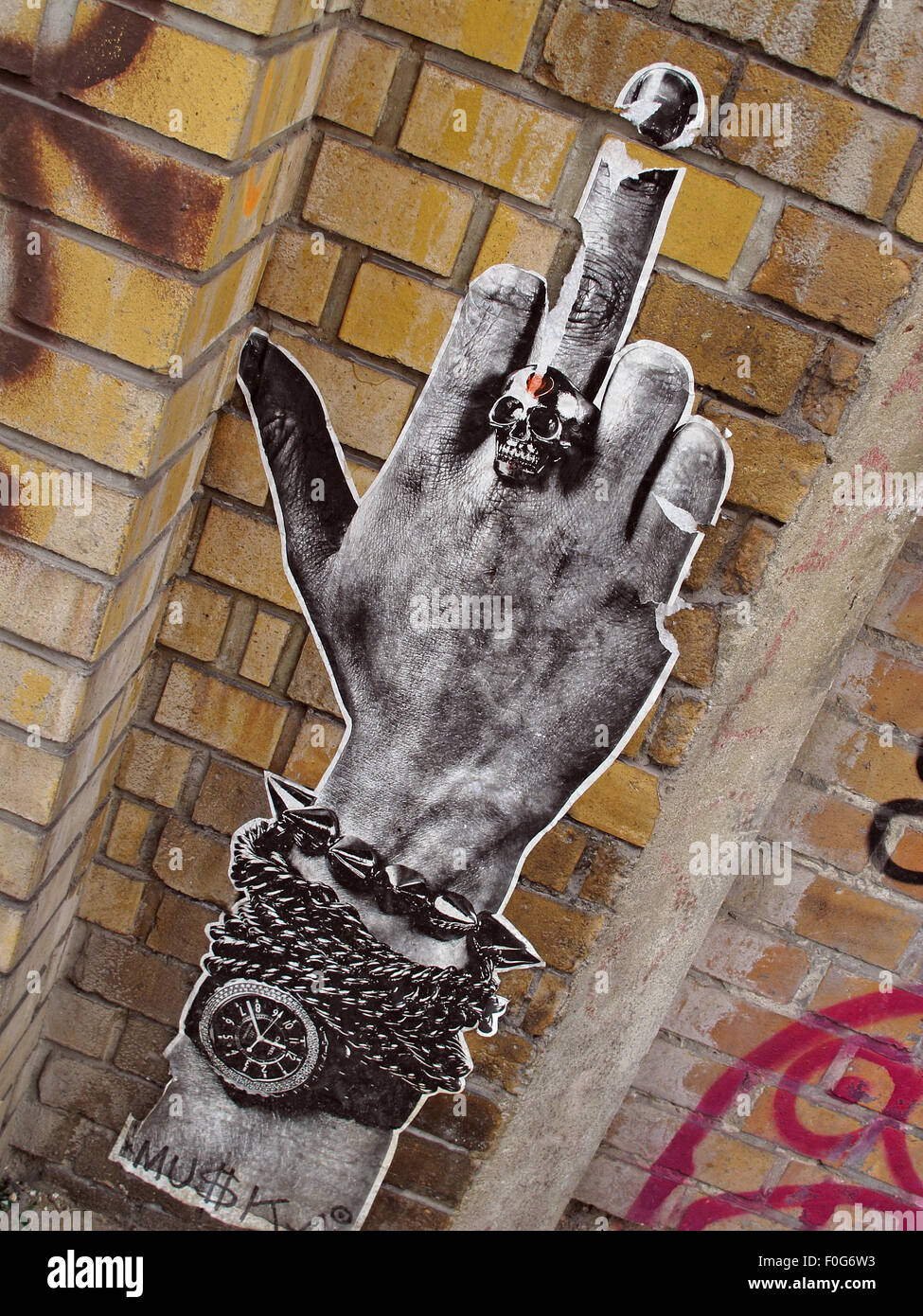 Berlin Mitte,Street art on walls,Germany,watch,arm,extended middle finger Stock Photo