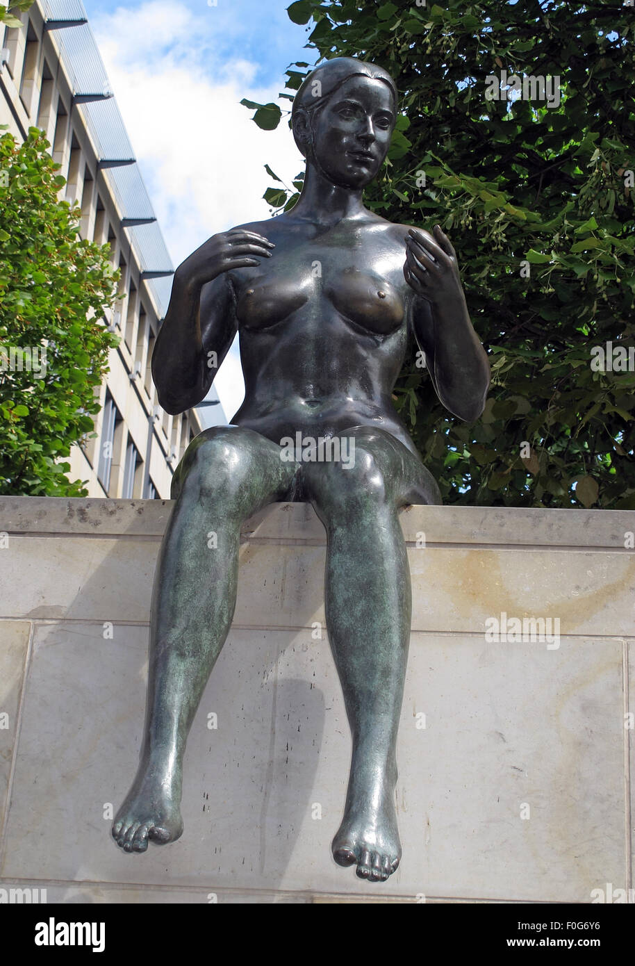 Three girls and a boy by Wilfried Fitzenreiter - Statue by the Spree River, Moabit, Berlin, Germany,frontview Stock Photo