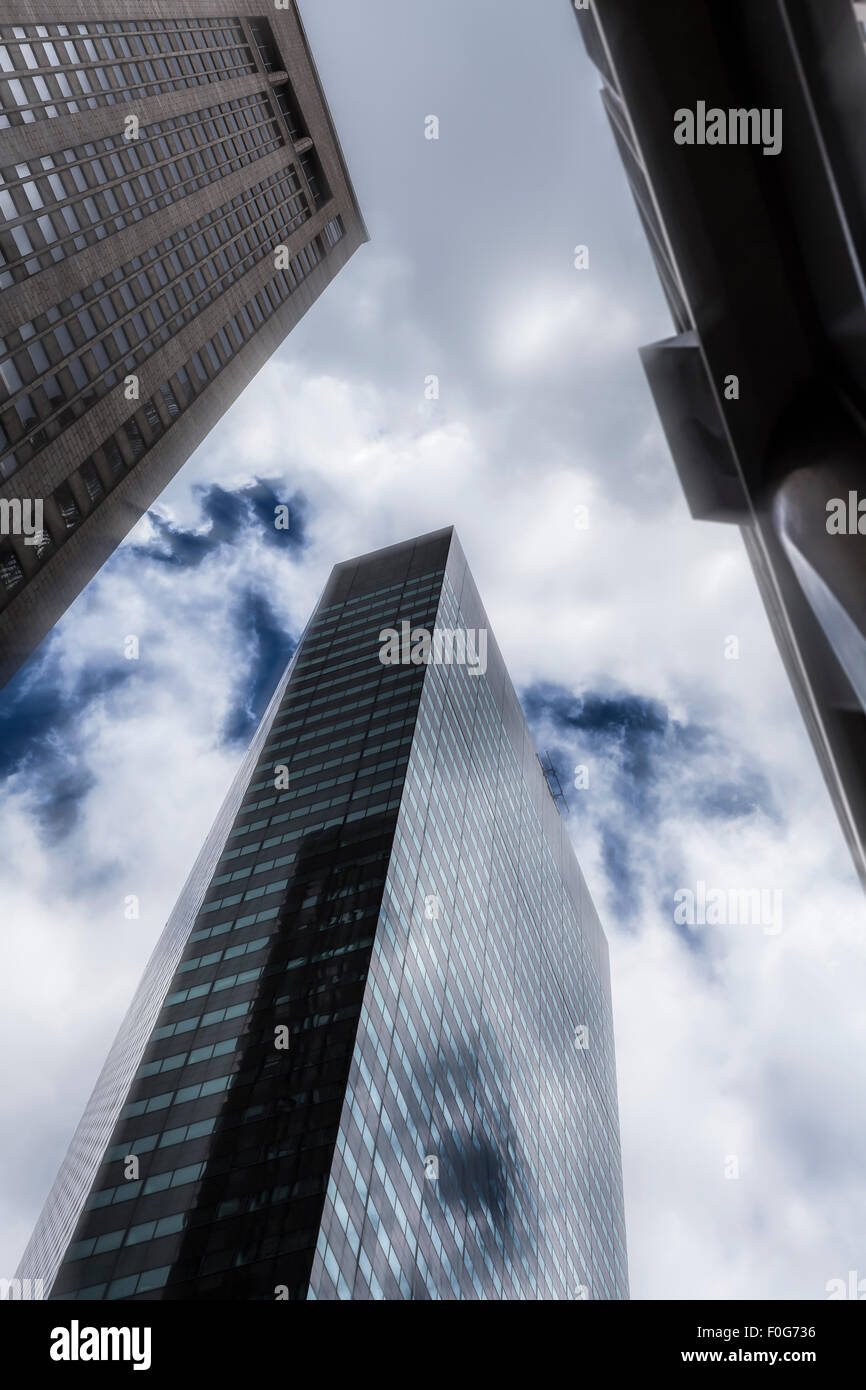 Modern skyscraper with dramatic sky in Manhattan, New York City. Stock Photo