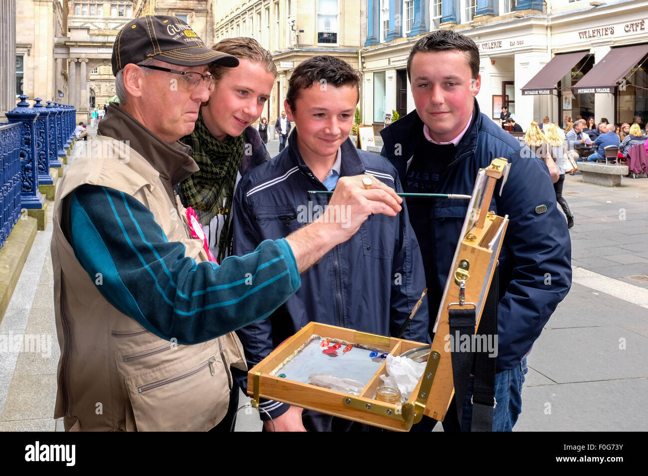 Glasgow, Scotland, UK. 15th Aug, 2015. Almost 150 artists came to Glasgow to take part in the "Rapid Painter" art competition with the aim being to make a painting capturing the spirit of Glasgow city, completed in 1 day. The artists attracted a lot of curiosity and interest from tourists and locals, when they set up in various locations about the city. All the completed works will go on exhibition on Sunday 16 August at the Royal Concert Hall, Sauchiehall Street, Glasgow when many of the paintings will be for sale. Credit: Findlay/Alamy Live News Stock Photo