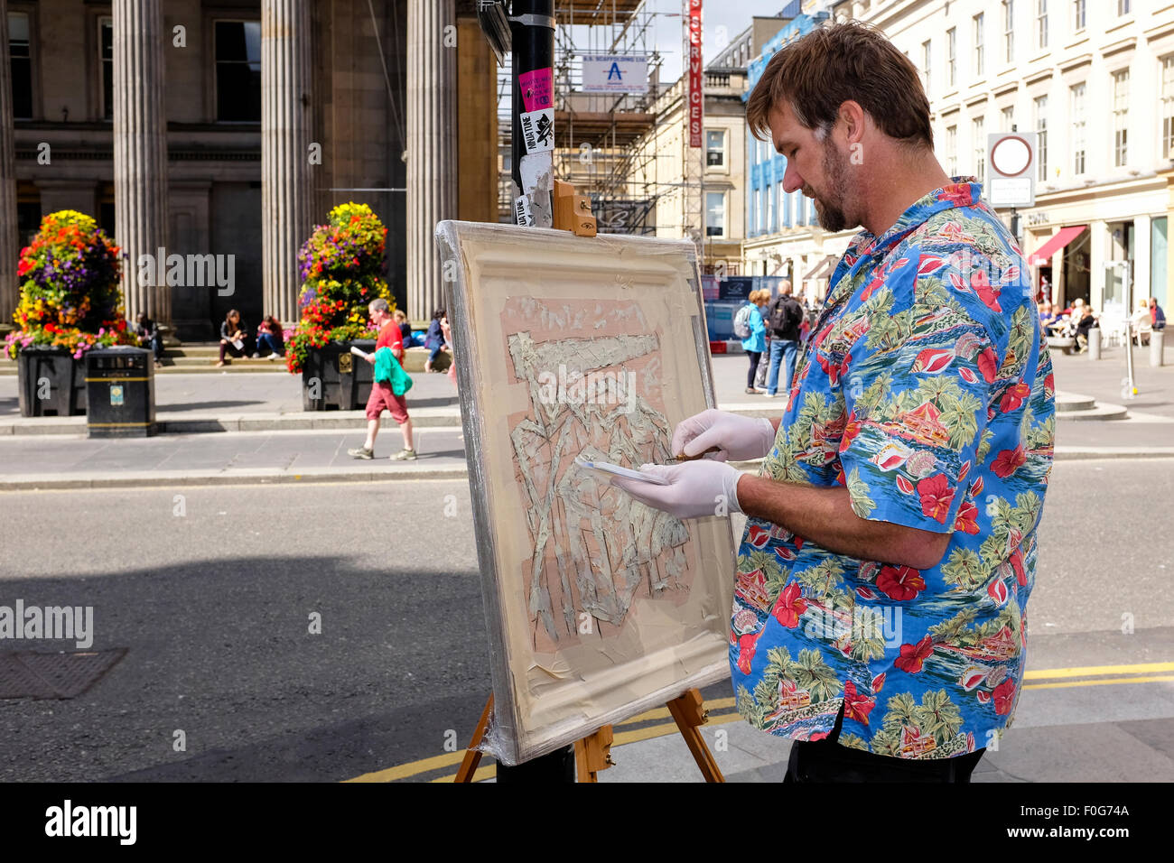 Glasgow, Scotland, UK. 15th Aug, 2015. Almost 150 artists came to Glasgow to take part in the "Rapid Painter" art competition with the aim being to make a painting capturing the spirit of Glasgow city, completed in 1 day. The artists attracted a lot of curiosity and interest from tourists and locals, when they set up in various locations about the city. All the completed works will go on exhibition on Sunday 16 August at the Royal Concert Hall, Sauchiehall Street, Glasgow when many of the paintings will be for sale. Credit:  Findlay/Alamy Live News Stock Photo