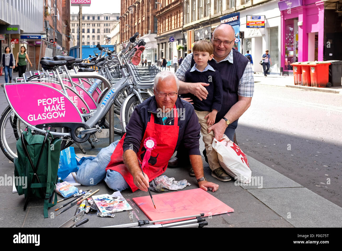 Glasgow, Scotland, UK. 15th Aug, 2015. Almost 150 artists came to Glasgow to take part in the "Rapid Painter" art competition with the aim being to make a painting capturing the spirit of Glasgow city, completed in 1 day. The artists attracted a lot of curiosity and interest from tourists and locals, when they set up in various locations about the city. All the completed works will go on exhibition on Sunday 16 August at the Royal Concert Hall, Sauchiehall Street, Glasgow when many of the paintings will be for sale. Credit: Findlay/Alamy Live News Stock Photo